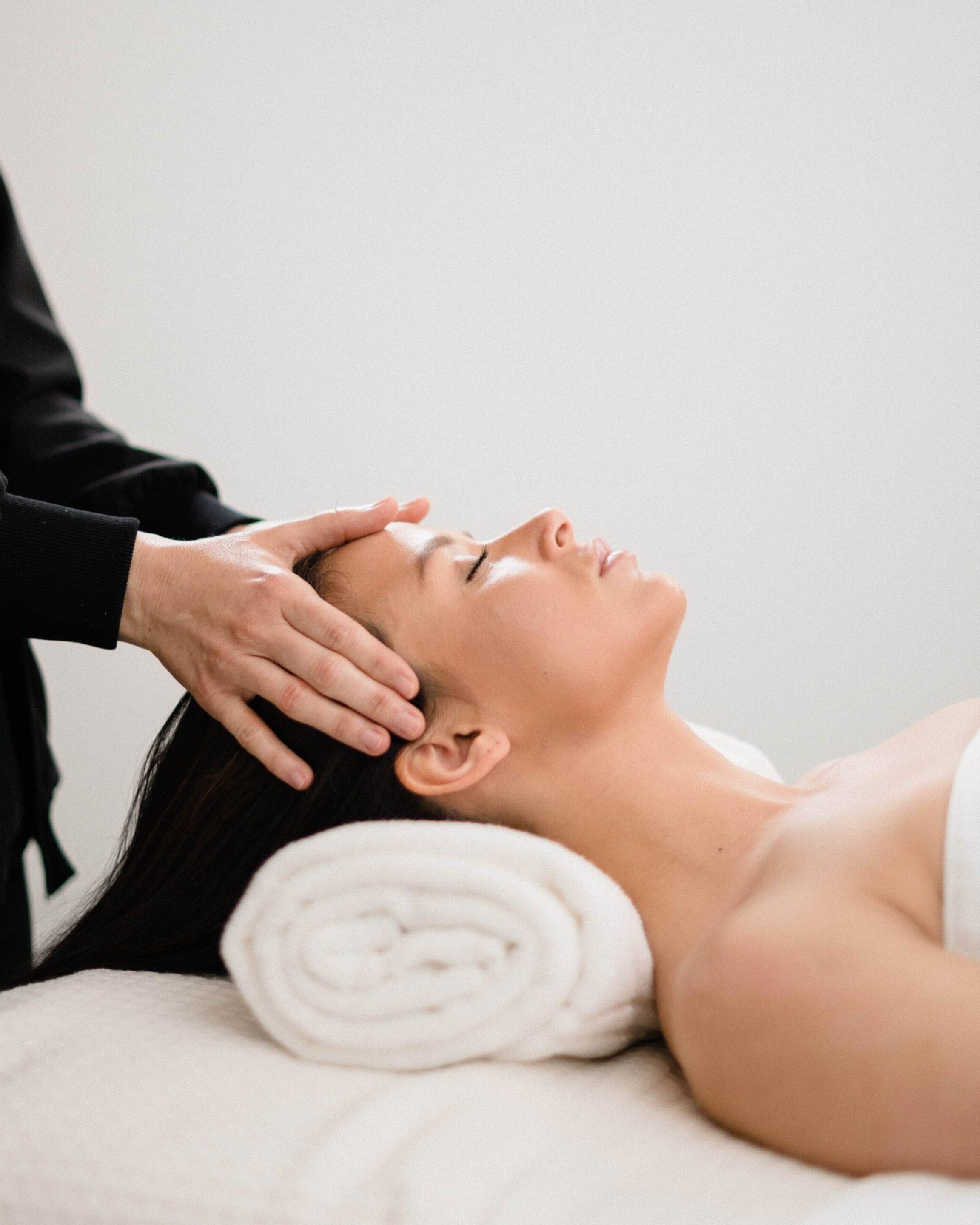 Nikki performing an acne treatment